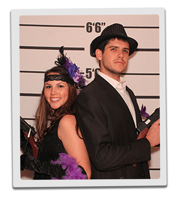 Kansas City Murder Mystery party guests pose for mugshots