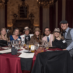 Kansas City Murder Mystery party guests at the table