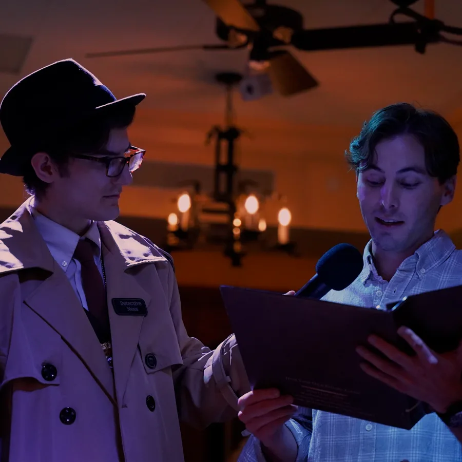 Professional actors performing at a Kansas City murder mystery