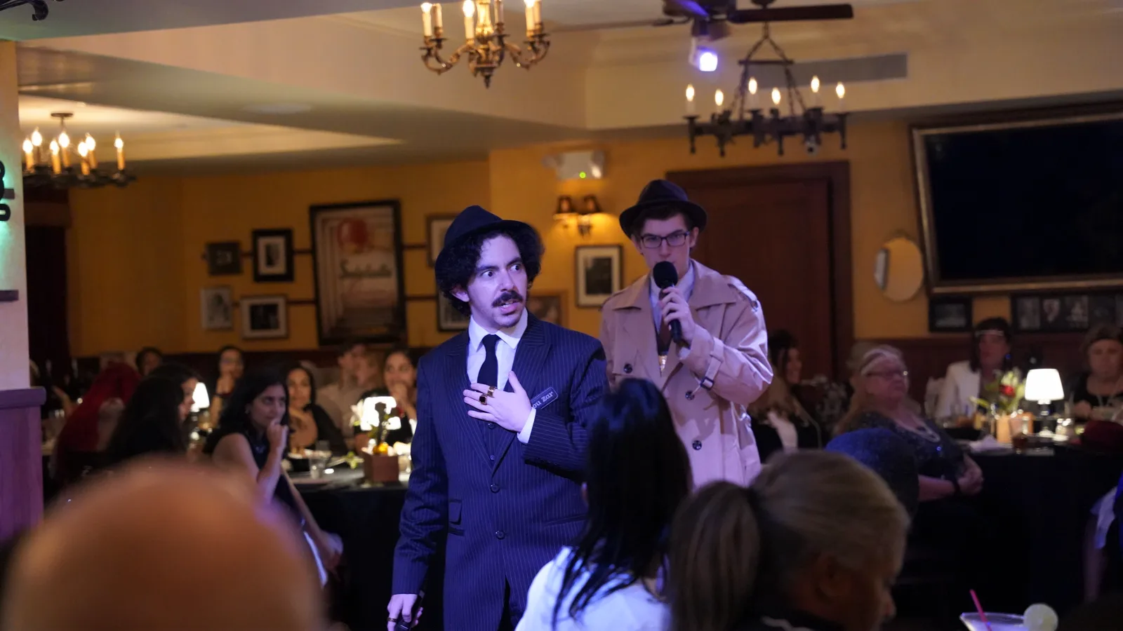 Actors performing a Murder Mystery Company dinner show